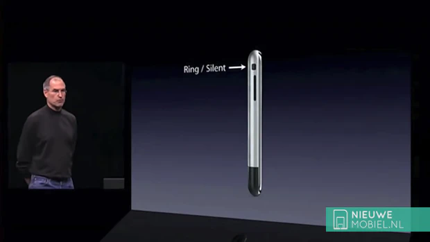 Steve Jobs shows out the 1st generation iPhone during a keynote in 2007 showing the mute button Steve Jobs shows off the 1st generation iPhone during a keynote in 2007 showing the mute button
