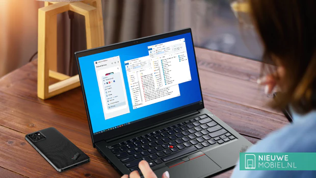 Lenovo ThinkPhone by Motorola next to a ThinkPad laptop Lenovo ThinkPhone by Motorola next to a ThinkPad laptop