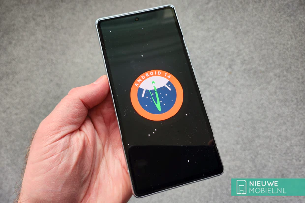 Front side of the Google Pixel 7a in Snow White Front with Android 14 splash screen