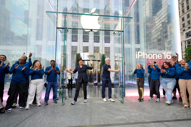 Deirdre O'Brien wit Tim Cook from Apple open Store Queue on Fifth Avenue in New York 2024
