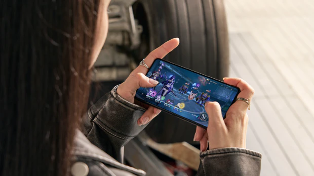Woman gaming on a Asus ROG phone