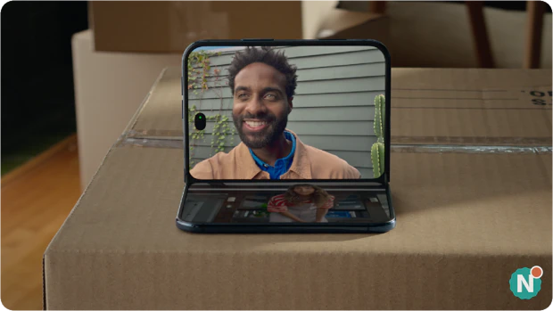 Apple iPhone Duo half unfolded on table during a Handsfree FaceTime call