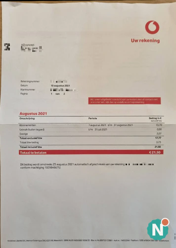 Papieren telefoonrekening van Vodafone op tafel