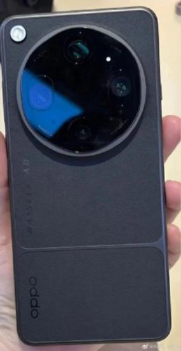 Detail shot of Oppo Find X9 Ultra in hand, showing the texture of the faux leather